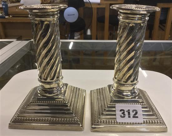 Pair of silver candlesticks, with twist columns and square bases